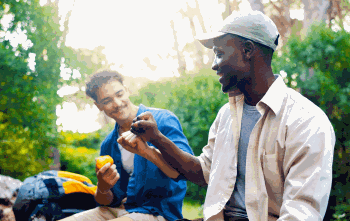 People eating snacks on a hike break.