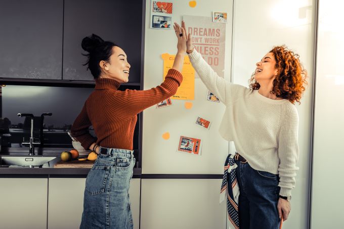 female roommates high-five