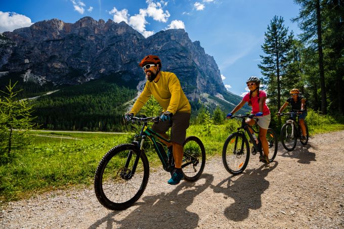 family cycling in the mountains