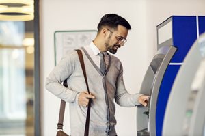 man using ATM